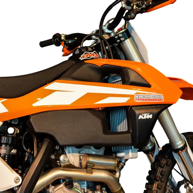 Orange and black dirt bike with 113336-BK1 IMS Fuel Tank Black 4.5 Gal