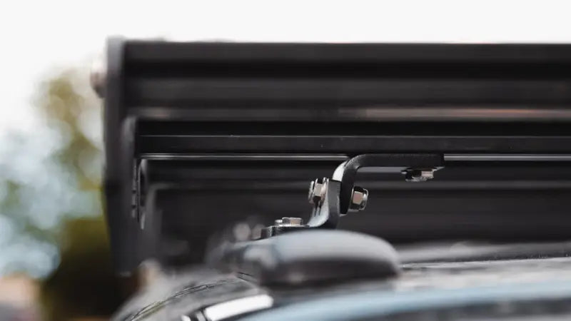 Black Sherpa Crow’s Nest truck topper rack with silver metal hooks