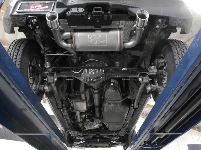 Underside of Ford Bronco with aFe Vulcan Cat-Back exhaust system showing dual pipes