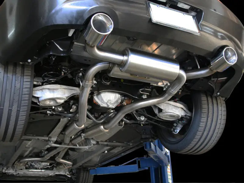 aFe Takeda 2-1/2in 304SS Cat-Back Exhaust System with Polished Tips installed on Infiniti G37/Q60, showcasing dual mufflers and mandrel bent stainless steel for optimized performance.