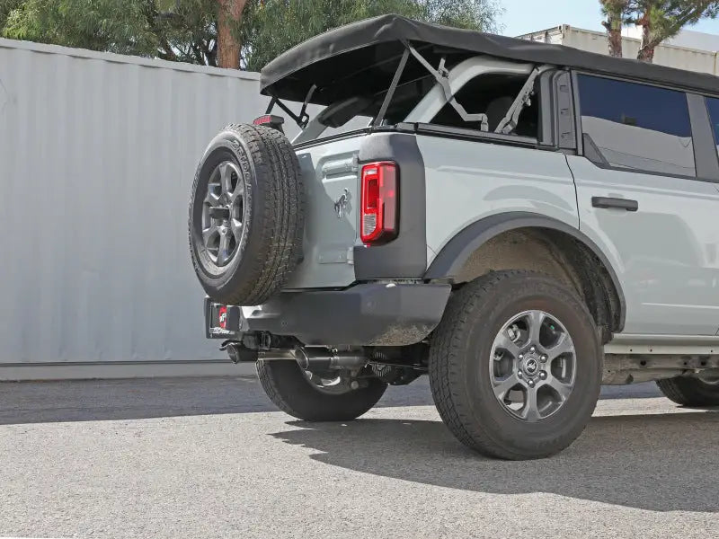 Gray Ford Bronco with spare tire showcasing afe vulcan 3in exhaust on a 2021 model