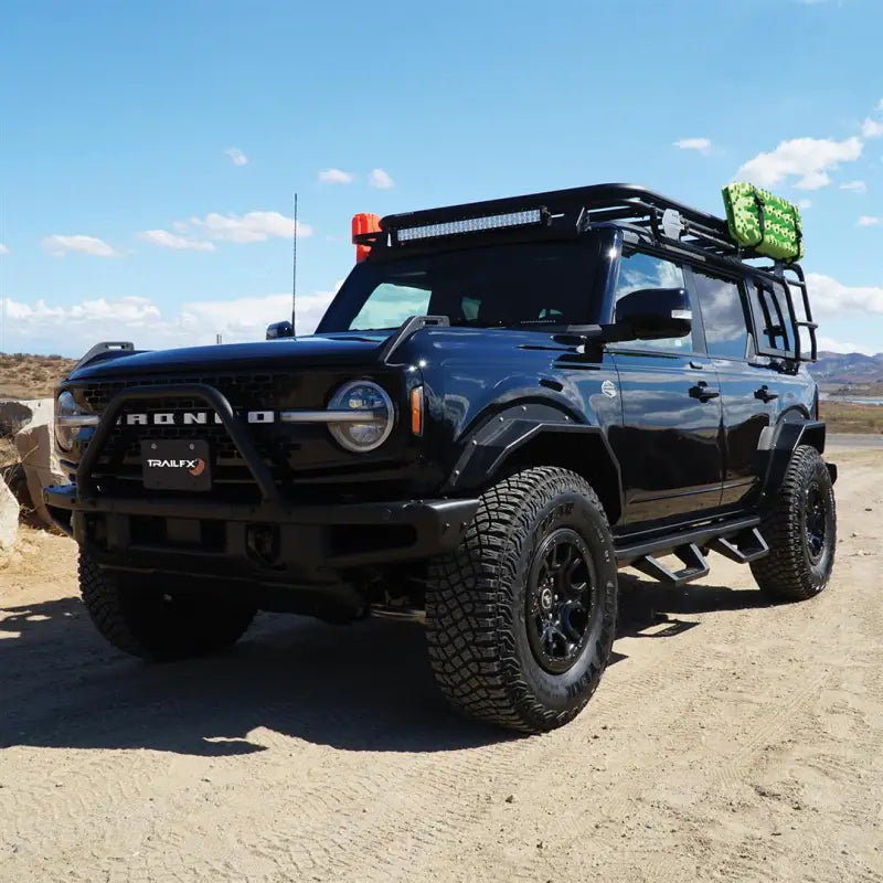 Black Ford Bronco with BR008T Trailfx rear angle tube fender off-road on rugged trail