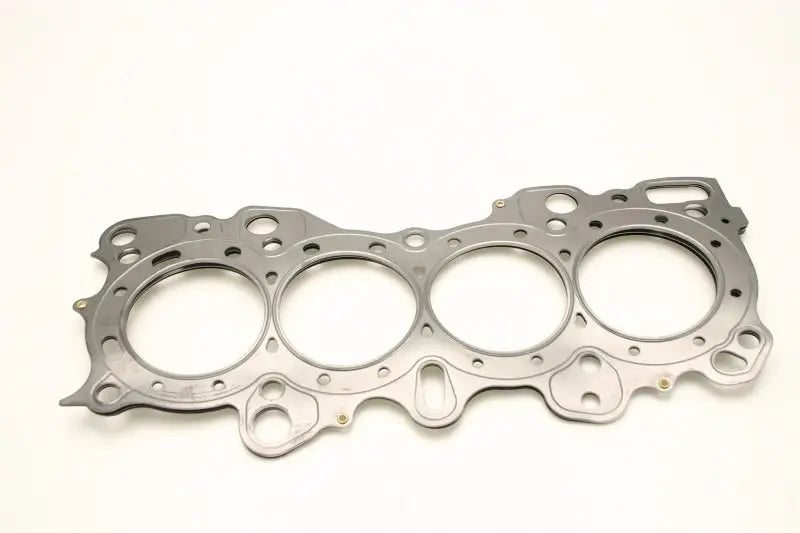 A Cometic Gasket Cometic Honda CRX/Civic/Integra -VTEC 81mm .030 inch MLS Head Gasket with four circular openings, designed for a Honda CRX/Civic/Integra VTEC 81mm engine. The gasket features an irregular shape with multiple holes and notches around its perimeter, displayed on a plain white background.