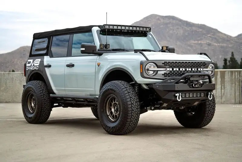DV8 Offroad 2021+ Ford Bronco with Modular Front Bumper Winch Capable and Auxiliary Light Mounts, showcasing durable design and advanced off-road capabilities.