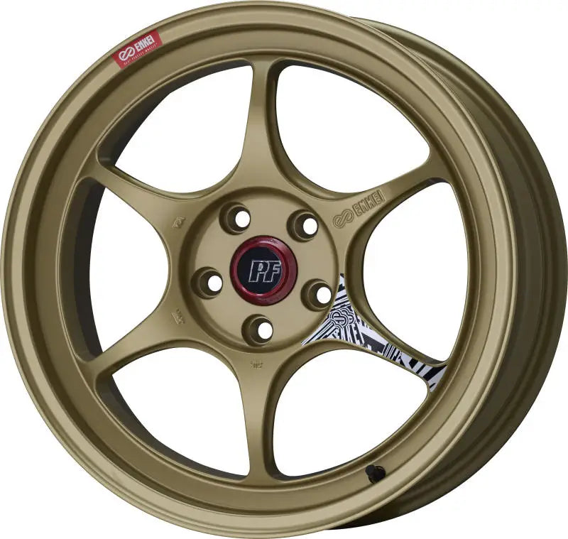 Gold-colored Enkei PF06 wheel with 27mm offset and 75mm bore for sleek rides