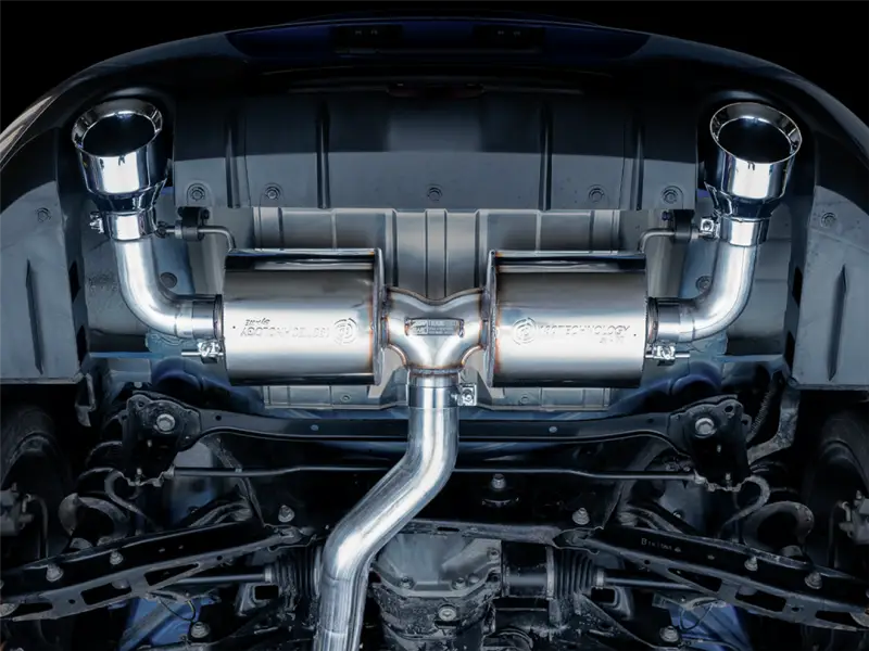 "Exhaust System Kit Stainless Steel; Without Muffler; Single Exhaust With Dual Outlet; Rear Exit; 5 Inch Chrome Silver Tips installed on a vehicle showcasing the AWE logo and 180 Technology resonators."