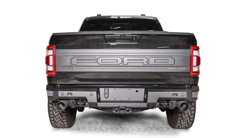 FR21-W5351-1 Fab Fours Premium Rear bumper installed on Ford F-150 Raptor, showcasing its rugged design and durable construction for enhanced rear-end protection.