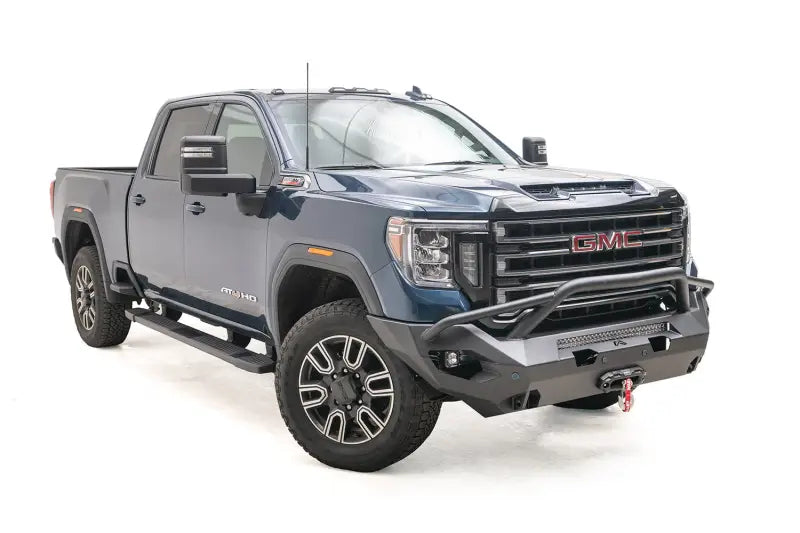 GM20-X5052-1 Fab Fours Matrix Front Pr installed on a blue GMC truck, showcasing robust construction and sleek design for superior off-road protection.