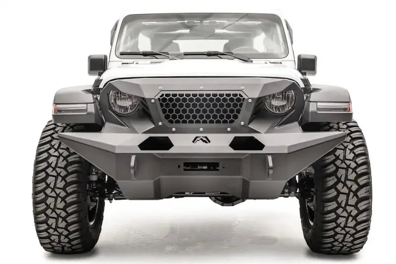 Front view of a white Jeep equipped with GR4610-1 Fab Fours 18 Jp Jl Grumper Full Width, showcasing its aggressive and protective full-width design.