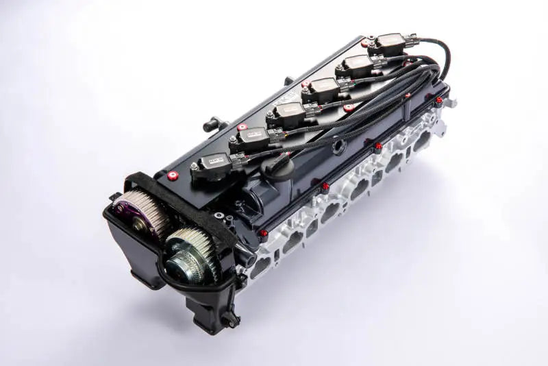HKS Super Fire Racing Coil Pro on black 2JZ engine block with exposed cylinders