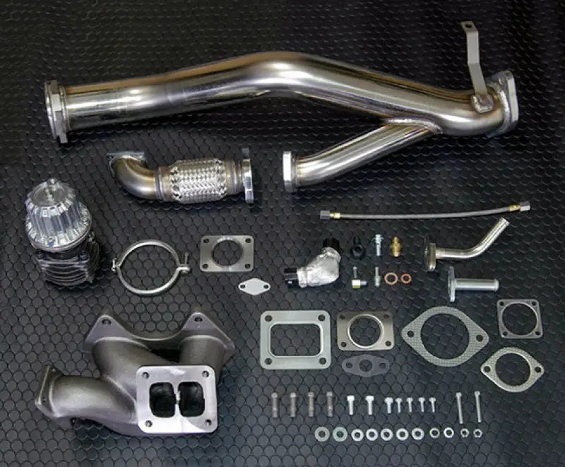 Shiny HKS turbo setup kit with polished stainless steel exhaust manifold for FD3S 13B