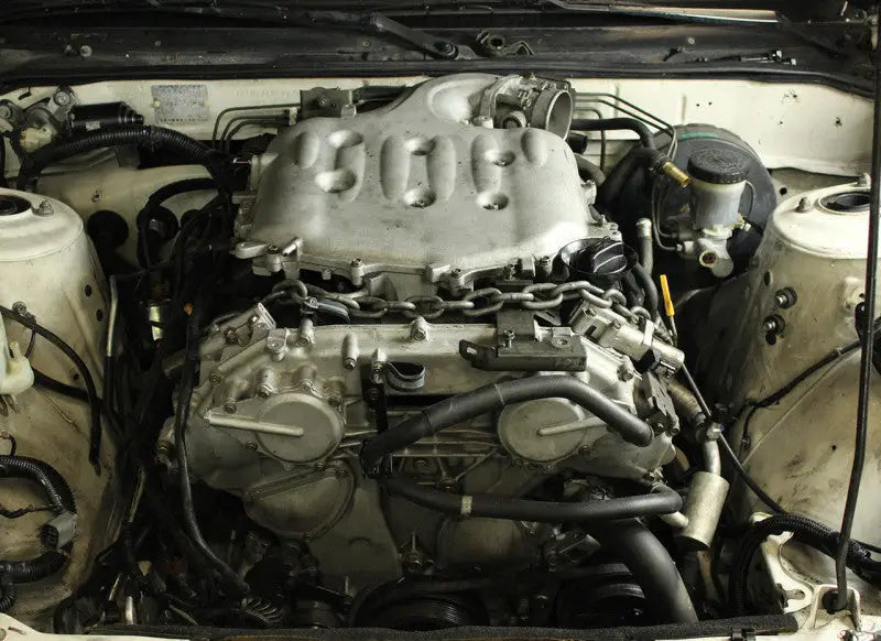 Car engine with chain showing ISR Performance VQ35DE Swap Mount for Nissan 240sx