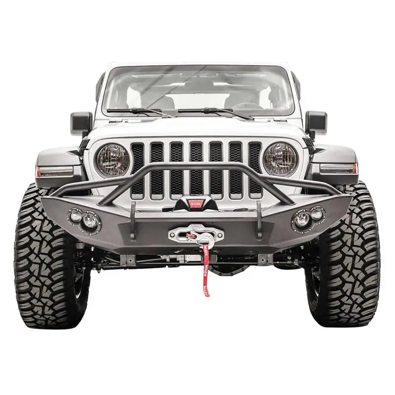 Fab Fours JL18-B4652-1 Lifestyle Winch Bumper with Guard on Jeep, showcasing rugged off-road design and superior protection.