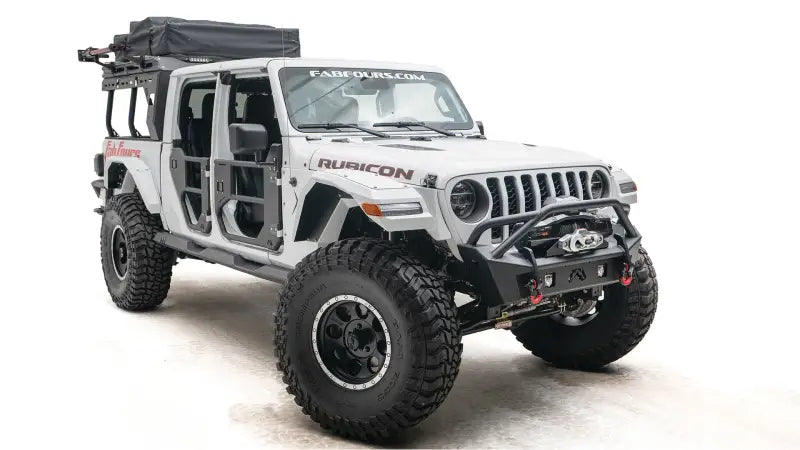 JL18-B4752-1 Fab Fours Jl/Jt Stubby With Pre-Runner Guard installed on a white Rubicon Jeep, showcasing superior off-road capabilities and aggressive styling, perfect for RV, automotive, powersports, marine, exterior, truck accessories, interior, truck bed, RV parts, Bumpers, Grilles & Guards, AVADA - Best Sellers, Must Haves