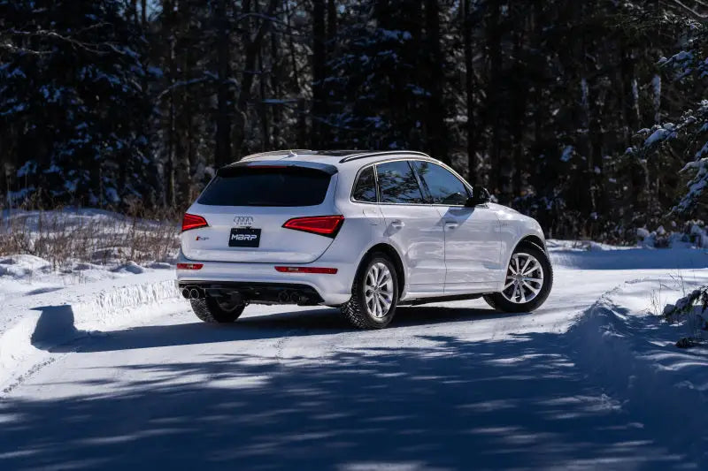 White Audi SQ5 SUV with dual rear exit MBRP exhaust system and quad carbon fiber tips