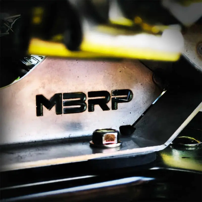 Metal plate with MBRP logo on Can-Am Maverick Trail Sport Series exhaust