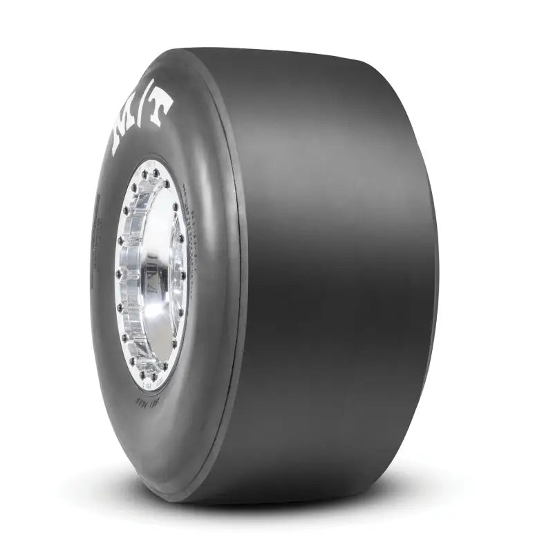 Mickey Thompson ET drag tire with black tread and silver hubcap
