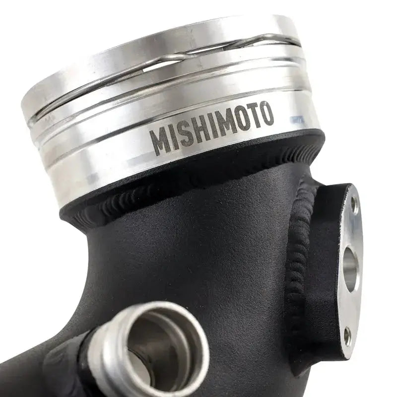 Black metal Mishimoto charge pipe for BMW N54 engine upgrade