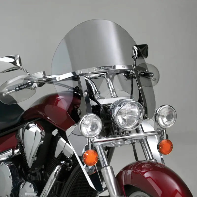 Red chrome motorcycle with clear windscreen and aux lights showcasing the N21413 Switchblade Chopped Windshield from National Cycle