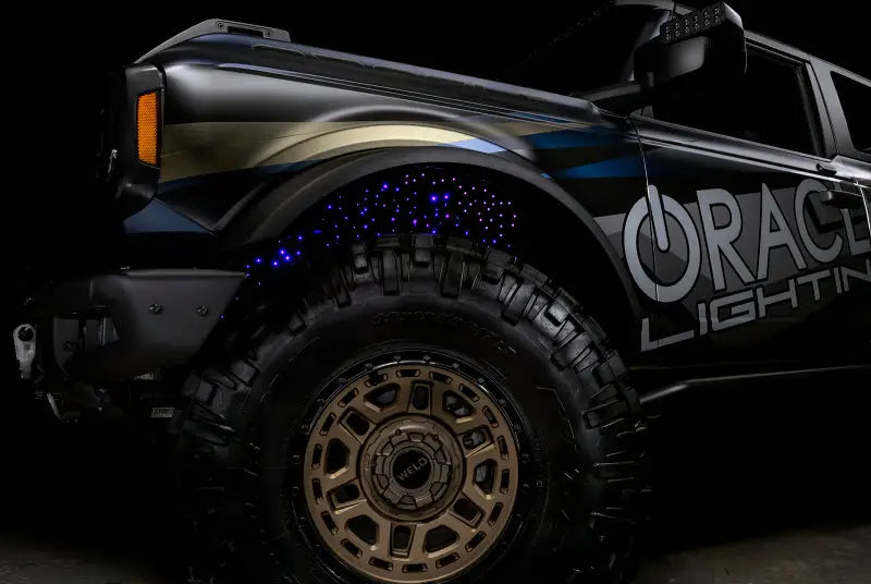 Black Ford Bronco with custom lighting featuring Oracle Lighting Fiber Optic Wheel and ColorSHIFT RGBW Kit