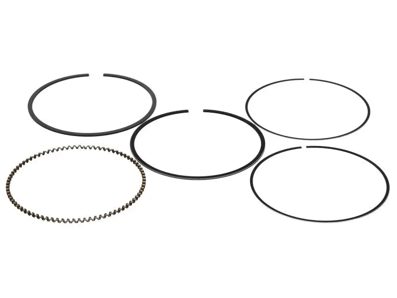 ProX ring set with five black piston rings, one serrated edge