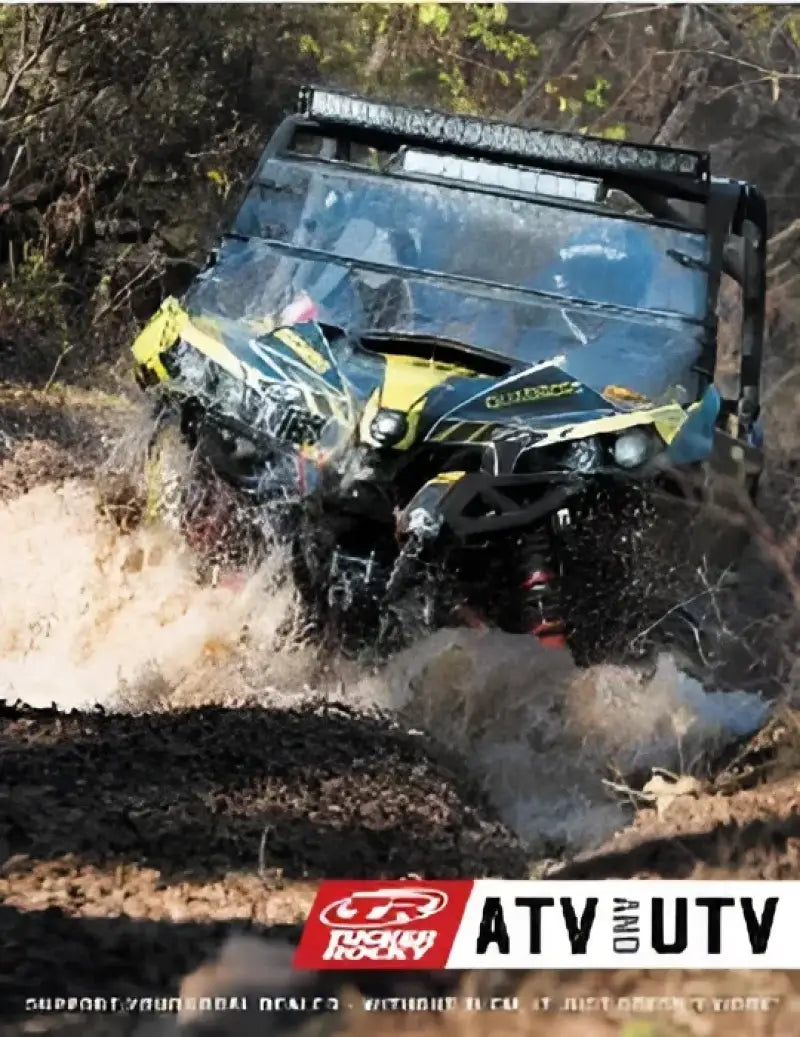 All-terrain vehicle splashing water with Suzuki LT-F400 carburetor kit installed on Eiger