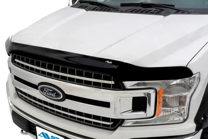 Black bug deflector on white Ford truck with Quadboss Sprocket Hat Hi-Vis displaying sprocket hat style