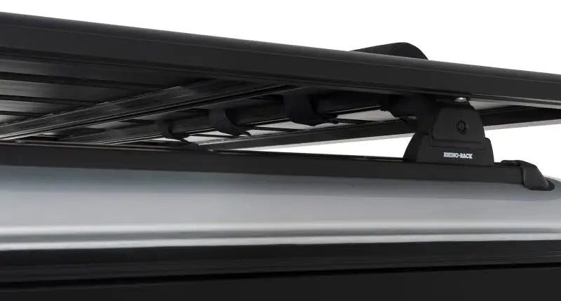 Rhino-Rack Pioneer wrap pads with straps for secure cargo on black roof rack