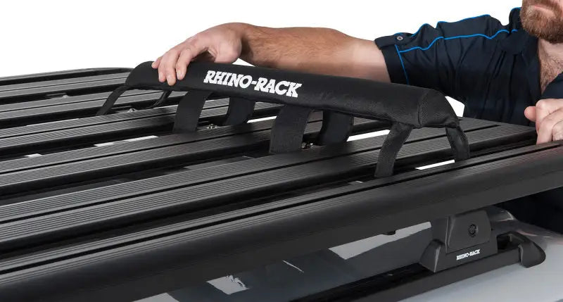 Black Rhino-Rack Pioneer wrap pads with straps and textured surface
