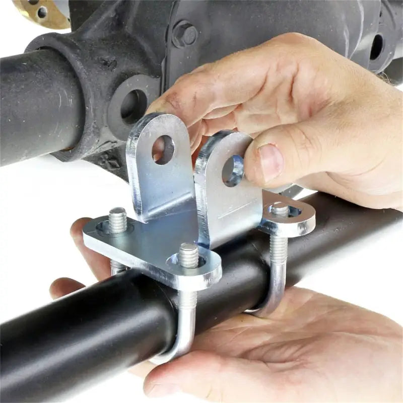 Metal bracket attached to black bar for RockJock JK Currectlync steering mounting kit