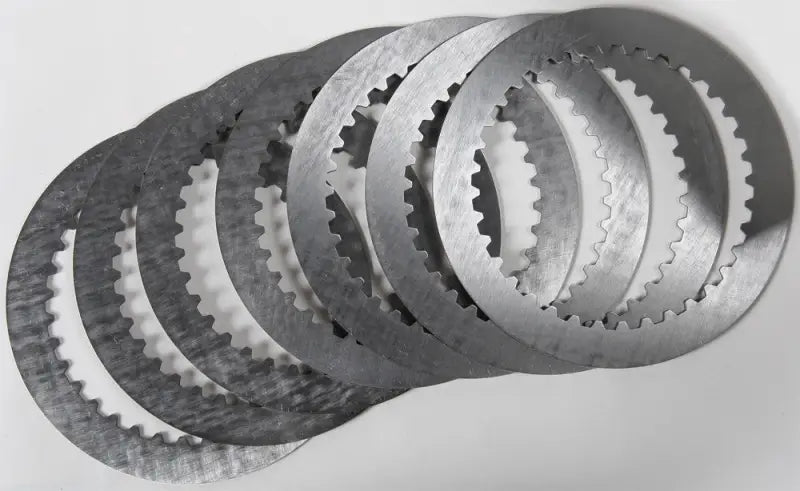 Stack of seven steel friction plates with internal gear teeth for sp095-8-001 high production tolerances
