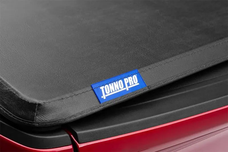 Black Tonno Pro tonneau cover with branding and strap for Toyota Tundra 6ft 7in bed