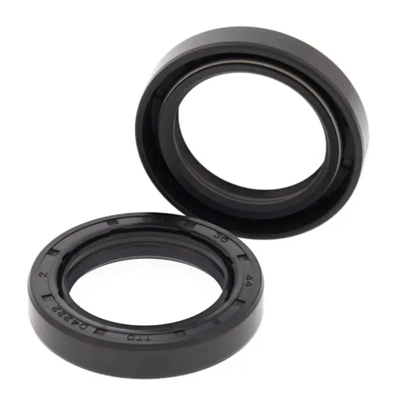 Black rubber oil seal ring with white markings and ribbed grip for powersports crankshafts