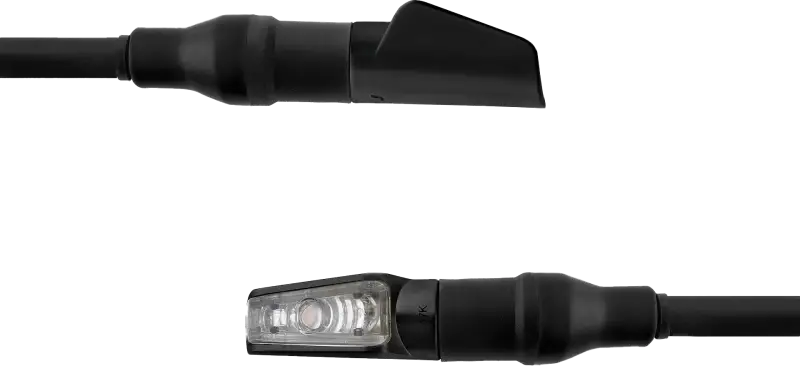 Black Harley Davidson motorcycle turn signal with clear lens and arrow design, perfect for electrical parts
