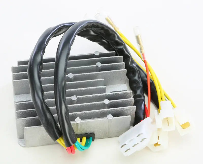 Silver automotive rectifier regulator with cooling fins and multi-colored wires for RV and truck parts