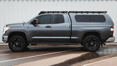 Dark gray Toyota Tundra with Sherpa Equip Little Bear full fairing for outdoor adventures