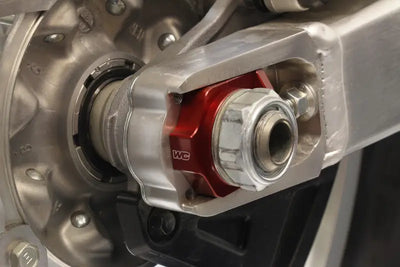 Motorcycle swingarm axle adjuster with Axle Blocks Elite Hon Red for precise tuning