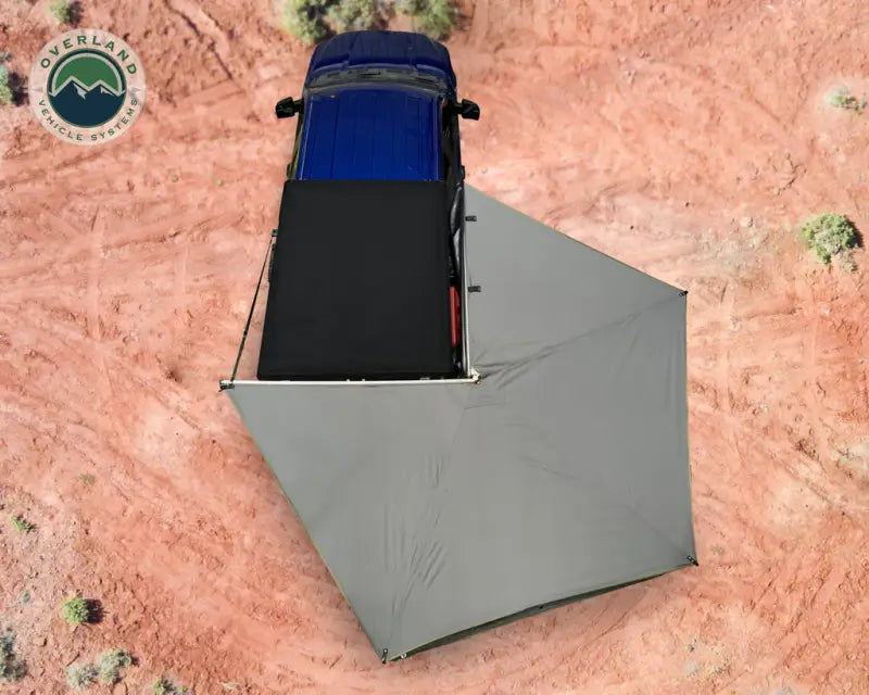 Blue truck with gray awning showcasing the 18379909 Overland VCL Nomadic 270 LT