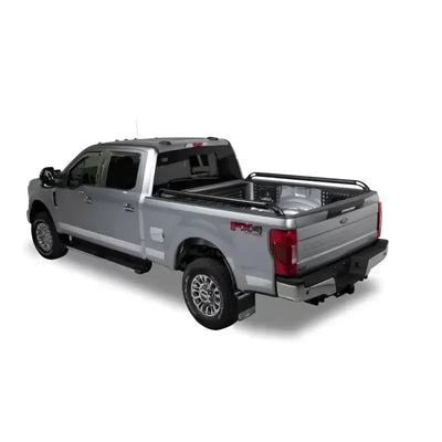 Silver pickup truck with bed rails.