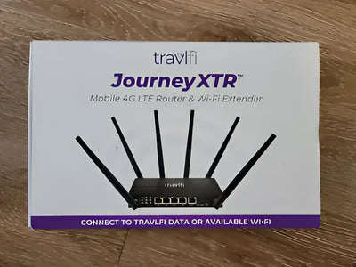 Travlfi Journey XTR Mobile 4G LTE Router & Wi-Fi Extender with multiple antennas shown on packaging.
