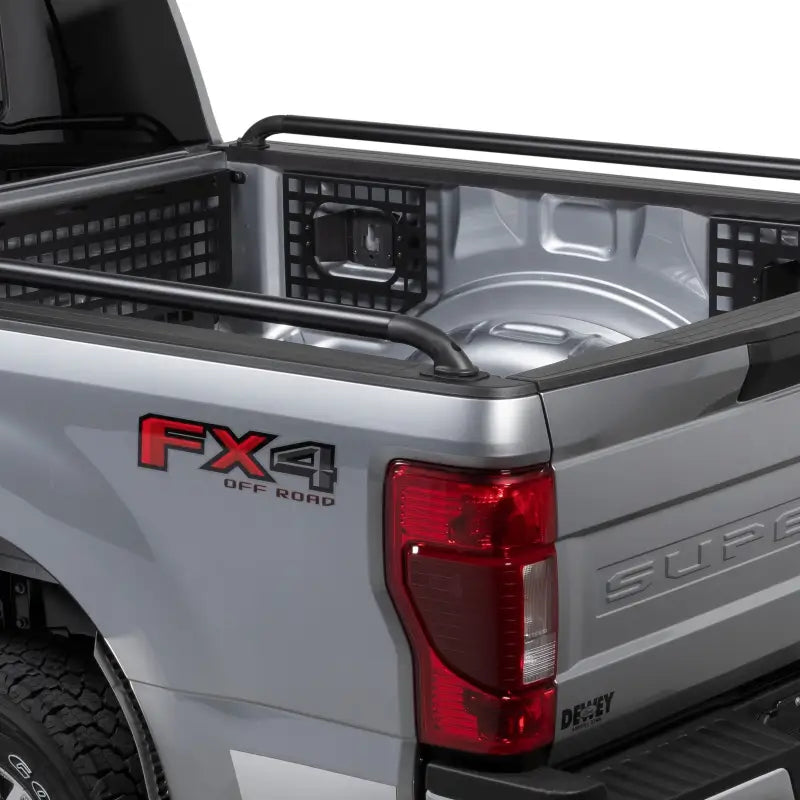 Silver pickup truck bed with Putco Black SSR Locker Side Rails for Chevrolet