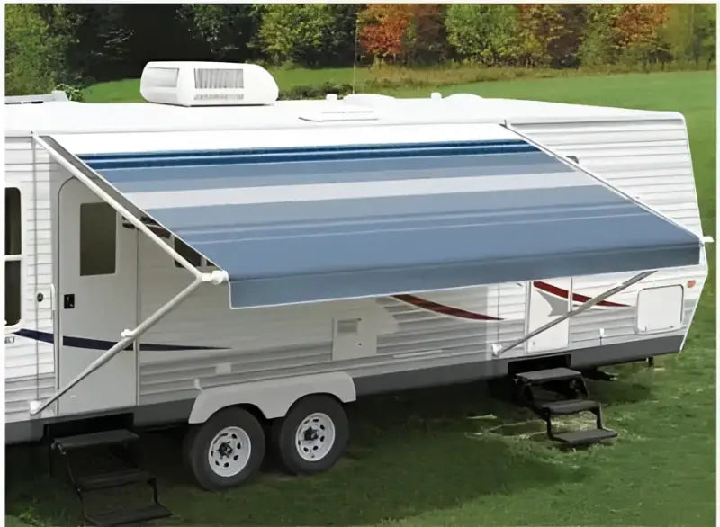 White RV with blue awning showcasing the 86178D8D Carefree Fiesta model