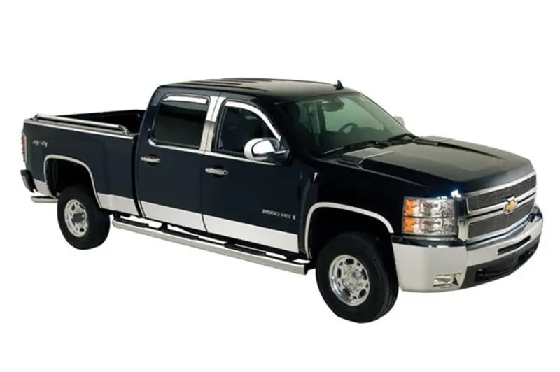 Black Chevrolet Silverado LD Crew Cab truck with chrome accents