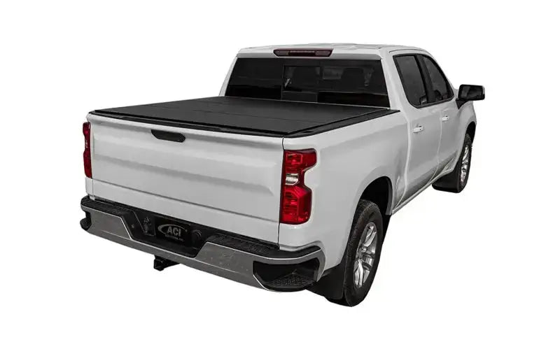 White pickup truck with black tonneau cover on access lomax tri-fold cover Ram 1500