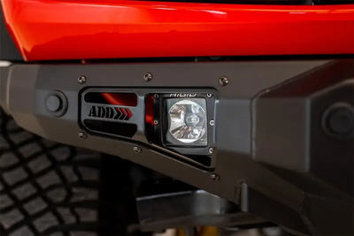 Addictive Desert Designs 2021+ Ford Bronco Stealth Fighter Front Bumper with Winch Mount - Hammer Black Finish, Integrated LED Cube Light, and ADD Logo.