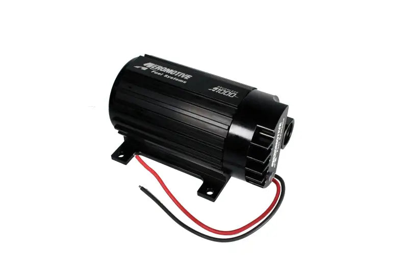 Black Aeromotive A1000 fuel pump with red and black wires in a close-up shot