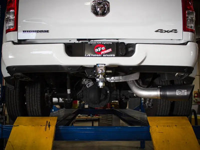 White pickup truck rear showing afe atlas 5in DPF-back exhaust on ram diesel truck