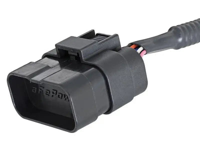 Black electrical connector with wires for afe scorcher blue module on Ford Explorer