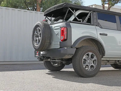 Gray Ford Bronco with spare tire showcasing afe vulcan 3in exhaust on a 2021 model