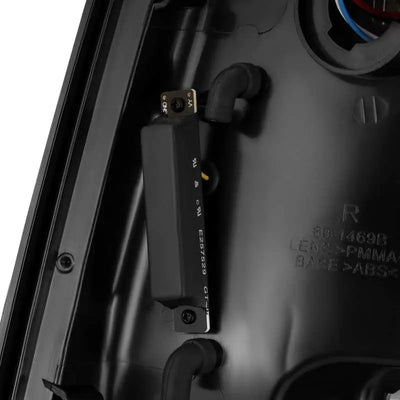 Close-up view of the AlphaRex 09-18 Dodge Ram 1500 PRO-Series LED Tail Lights in Jet Black, showing detailed components and wiring.